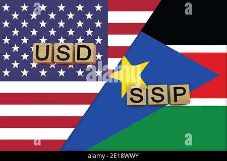 USA and South Sudan currencies codes on national flags background. International money transfer concept Stock Photo
