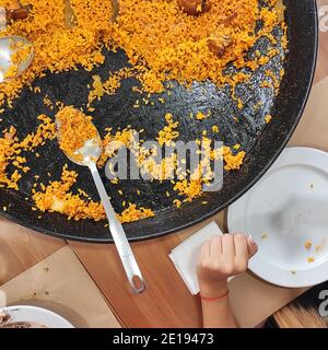 Yellow paella rice top view with a spoon Stock Photo