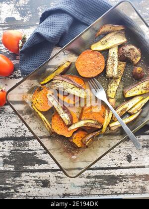 Baked vegetable in a wood table background Stock Photo