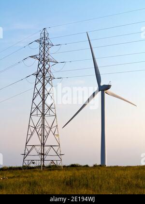 Senvion MM82/2050 wind turbines and electricity pylon at Carsington Pasture near Brassington in the Derbyshire Dales England UK Stock Photo