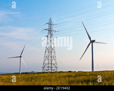 Senvion MM82/2050 wind turbines and electricity pylon at Carsington Pasture near Brassington in the Derbyshire Dales England UK Stock Photo