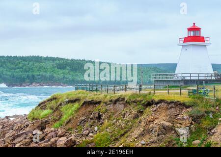 The Neils Harbour lighthouse, in Cape Breton island, Nova Scotia, Canada Stock Photo
