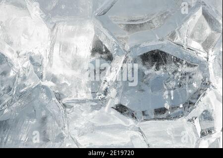 ice background. Light Blue Spring ice. Frozen background of ice. Abstract ice background. Blue background with cracks on surface Stock Photo