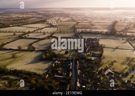 Aerial drone photo of a Cotswolds Village, a rural scene in English countryside with houses, property and real estate in the UK housing market, Bourton on the Hill, Gloucestershire, England Stock Photo