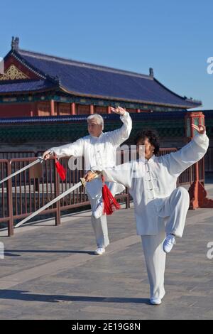 Two old people playing Tai Chi in the park high quality photo Stock Photo