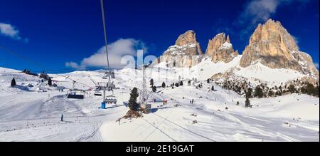 Winter Panorama of Ski Slope and Snowy Rock in Selva Di Val Gardena in Italian Dolomites. Beautiful Winter Scenery in Italy. Stock Photo