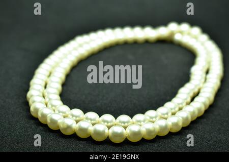 pearl necklace arranging on black background Stock Photo