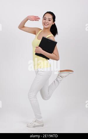 A young beauty lady holding a book high quality photo Stock Photo