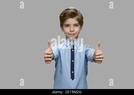 Cute little boy giving two thumbs up. Stock Photo