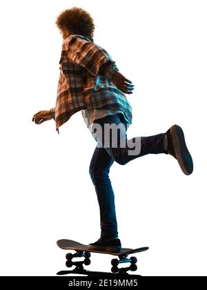 one caucasian young man skateboarder Skateboarding in studio silhouette shadow  isolated on white background Stock Photo