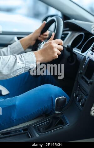 Comfort of driving. Vertical cropped shot of a man holding a steering wheel while sitting in a car Stock Photo