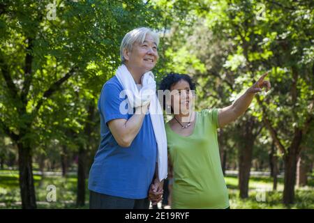 Two old people exercising in the park high quality photo Stock Photo