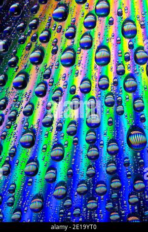 Water droplets on a reflective surface. England UK GB Stock Photo