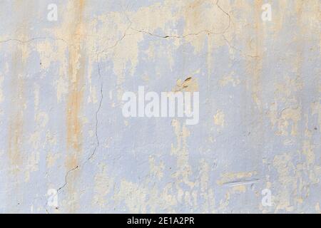 Peeling paint on the wall seamless texture. Material template in rustic blue grunge style. Stock Photo