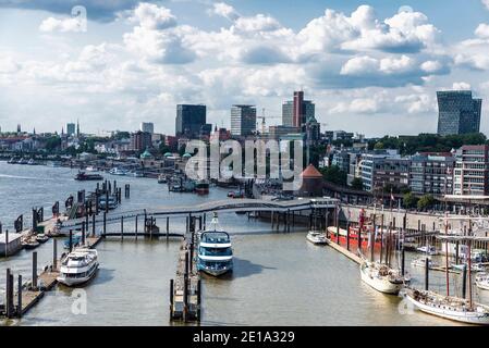 Hamburg, Germany - August 21, 2019: Overview of the pier on the Elbe river with cruise ships, boats and sailboats in St. Pauli, Hamburg, Germany Stock Photo
