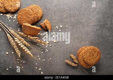 Homemade cereal oatmeal cookies on grey table background. Healthy Food Snack Concept. Copy space Stock Photo