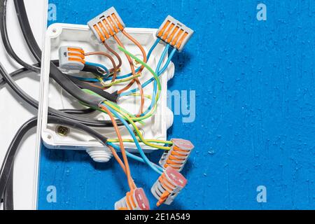 electrical wires in the box. wires without insulation. security. Stock Photo