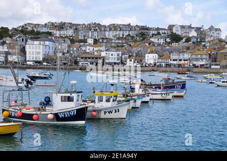Fishing boats on a bright summers day in St Ives harbour,Cornwall.UK Stock Photo