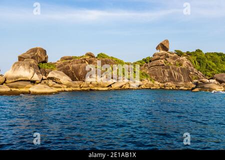 Granite rocks and tropical foliage in Thailand's Similan Islands Stock Photo