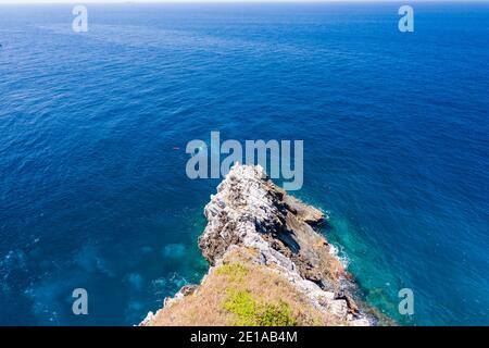 Aerial drone view of SCUBA divers on a coral reef off a beautiful remote tropical island (Ko Bon, Similans) Stock Photo