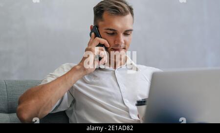 close up. young entrepreneur is talking on a smartphone. Stock Photo