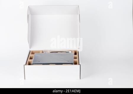 Paper box, inside wifi router, wireless device with three antennas on white background. Stock Photo