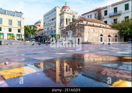 Greek orthodox church reflection in Monastiraki square of Athens, Greece Stock Photo