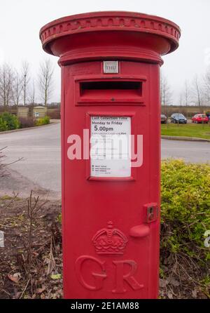 Traditional British red post box Stock Photo