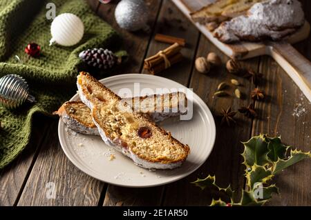 Christmas stollen on wooden background. Traditional German  festive sweet bread pastry dessert. Stollen for Christmas Stock Photo