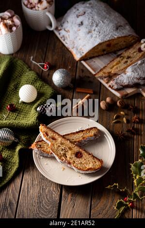 Christmas stollen on wooden background. Traditional German  festive sweet bread pastry dessert. Stollen for Christmas Stock Photo