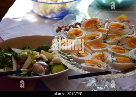 Healthy food with a buffet table with boiled eggs, vegetables and salads. Stock Photo