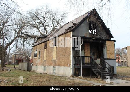 Fire-damaged abandoned brick home in Engelwood on Chicago's South Side Stock Photo