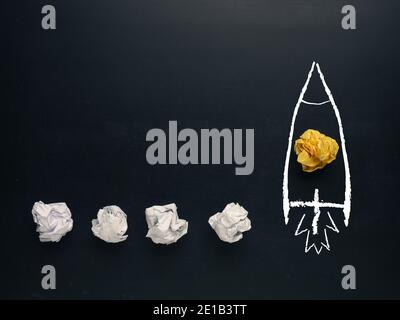 Launching rocket of paper balls, creativity concept or new ideas metaphor, start up business , new year’s resolution Stock Photo