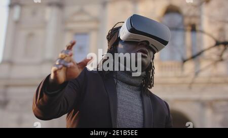 African american black man vearing VR headset in the park. High quality photo Stock Photo