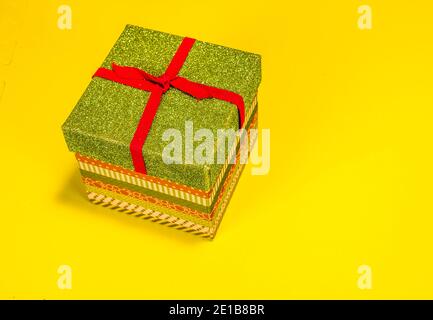Christmas Gift Box On Yellow Background Stock Photo