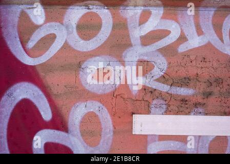 Abstract background texture and random graffiti art. Scratched surface lettering patterns and colours. Stock Photo