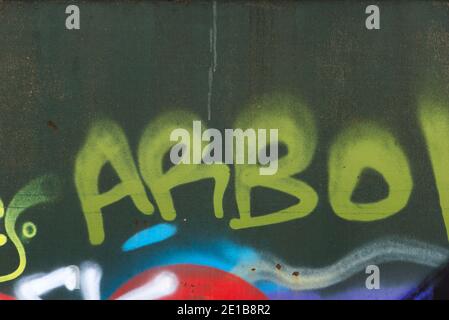 Abstract background texture and random graffiti art. Scratched surface lettering patterns and colours. Stock Photo