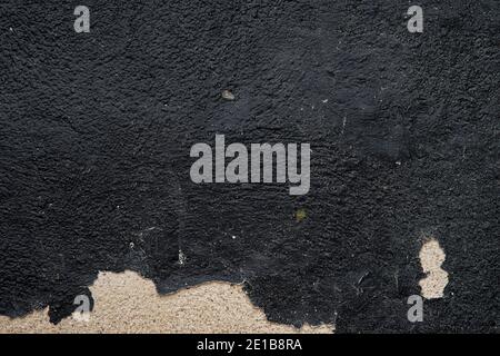 Vintage grunge texture of old weathered dirty wall. Painted cracked walls, textured in cracks and drips of paint. Unique scenic unusual background. Cement wall with stain marks. A texture of an old orange wall. High quality photo Stock Photo