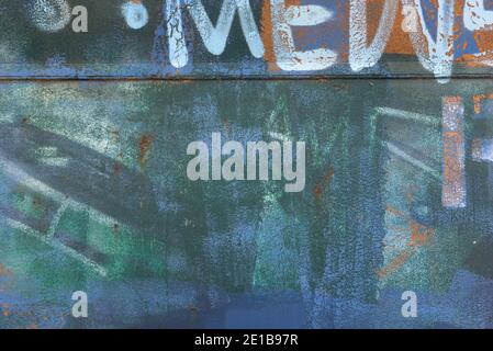 Abstract background texture and random graffiti lettering. White and orange scratched surface patterns. Stock Photo