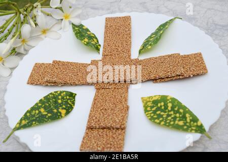 Til sakri or Tilgul an Indian traditional popular sweet made out of Sesame seeds and jaggery. Famous Sankranti festival dessert arranged decorated wit Stock Photo