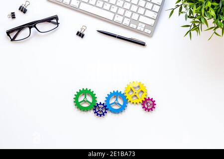 Working gears cogwheels mechanism on working place, ofiice table. Top view Stock Photo