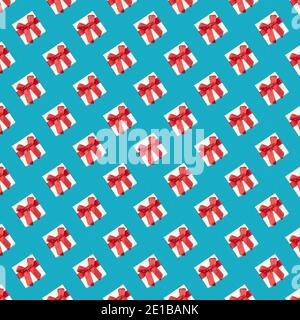 Seamless pattern of white boxes with red ribbons on a blue background. Print, design. Square pattern Stock Photo