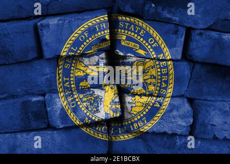 State of Nebraska flag painted on brick wall Stock Photo