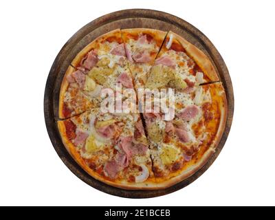 Top view of Hawaiian pizza with sweet pineapple and salty ham and mozzarella on a wooden bard isolated on white background Stock Photo