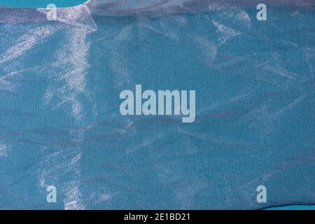 Blue crumpled organza fabric. Abstract background. Stock Photo