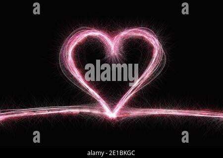 Pink sparkles heart on black background. Valentines day card Stock Photo