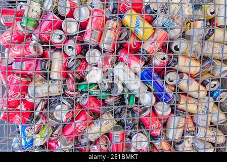 A large see through steel cage of used aluminium (aluminum) cans collected ready for recycling in Australia Stock Photo
