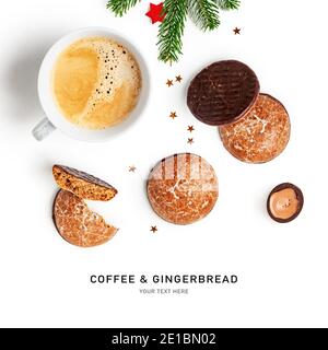 Coffee cup, gingerbread cookies, chocolate candy, spruce branch and stars creative layout on white background. Winter sweets composition. Christmas ho Stock Photo