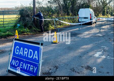 Midleton, County Cork, Ireland. 6th Jan, 2021. Skeletal remains were found on the Midleton to Youghal Greenway last night, just outside Midleton. Gardai have the road leading to the discovery sealed off. A Garda forensics officer arrives at the scene. The pathologist is due to examine the remains this afternoon. Credit: AG News/Alamy Live News Stock Photo