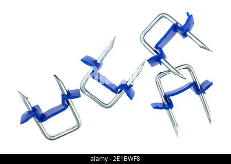 Several electric wire staples with plastic saddle isolated on a white background. Stock Photo